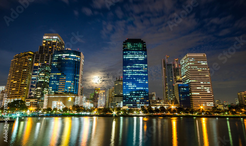 Bangkok city downtown at night with reflection of skyline, Bangk © tamsak