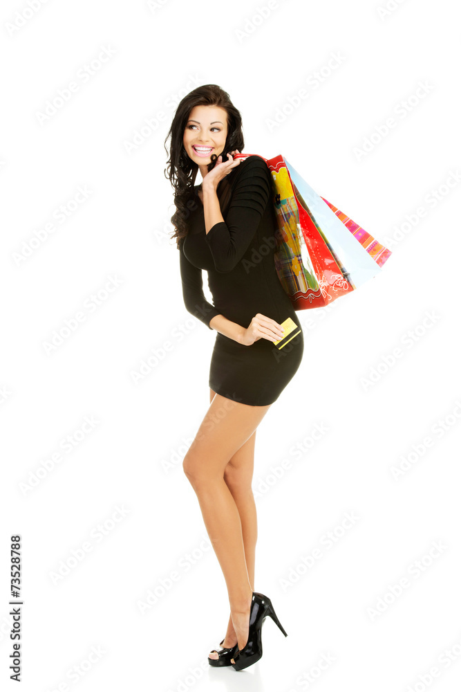 Full length woman with a lot of shopping bags Full length woman with a lot of shopping bags
