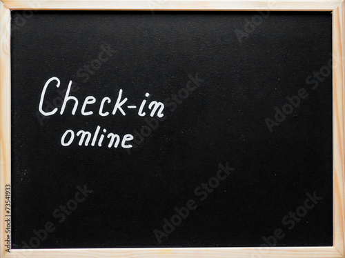 Check-in online message written on blackboard