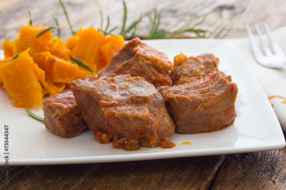 Pork stew garnished with pumpkin Pork stew garnished with pumpkin