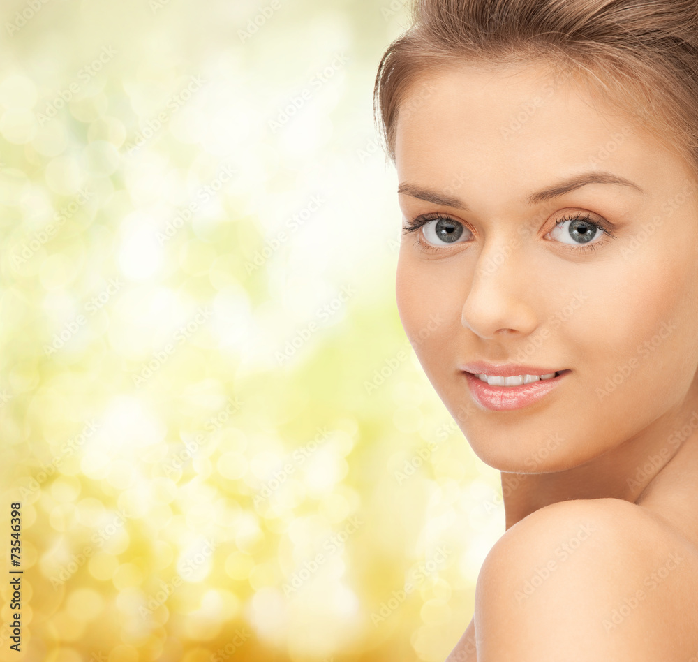 beautiful young woman over yellow background beautiful young woman over yellow background