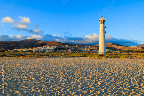 Lighthouse on Morro Jable beach at sunset, Fuerteventura island