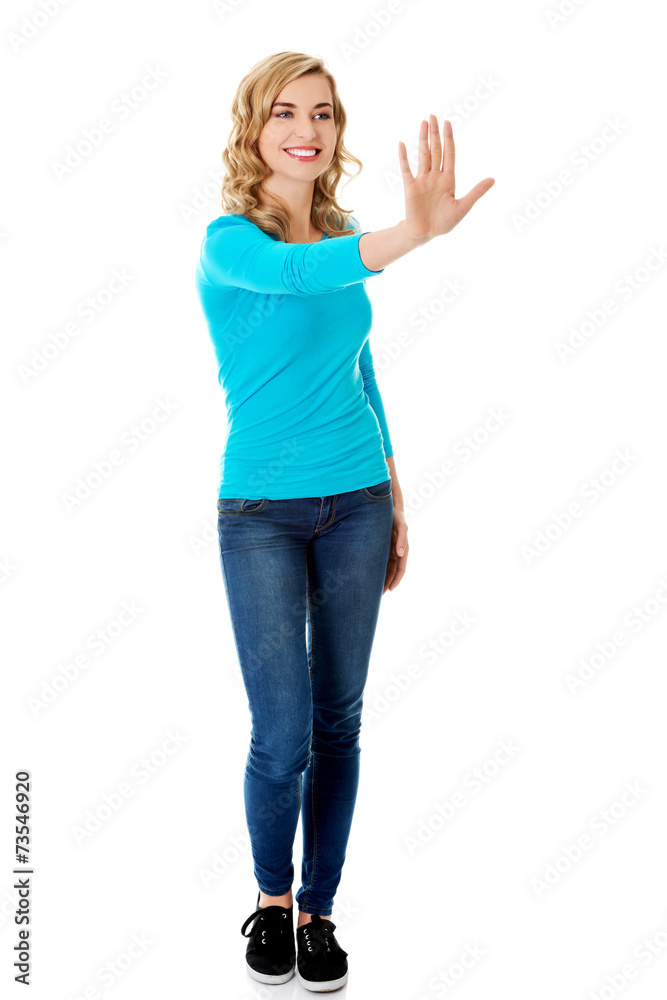 Front view woman pulling imaginary screen Front view woman pulling imaginary screen