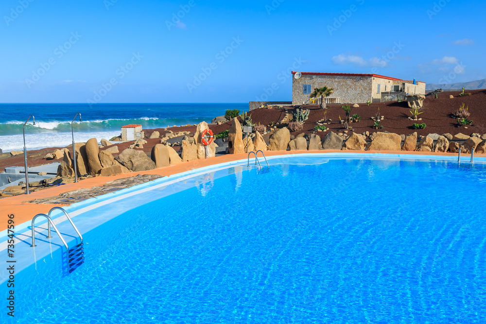 Swimming pool in mountain landscape of Fuerteventura island