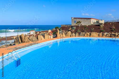 Swimming pool in mountain landscape of Fuerteventura island