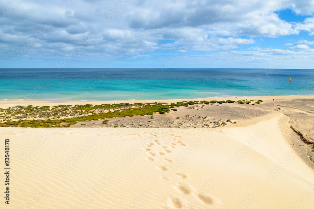 Footprints on sand dune on Sotavento beach, Fuerteventura island Footprints on sand dune on Sotavento beach, Fuerteventura island
