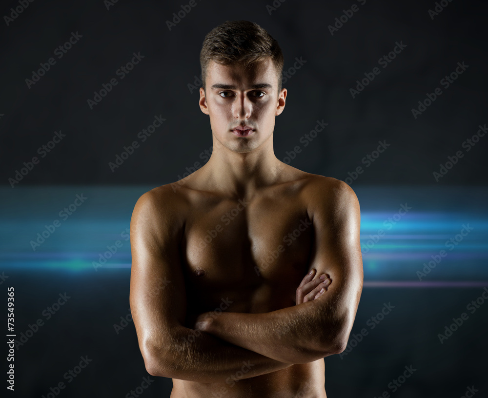 Fototapeta premium young male bodybuilder with bare muscular torso
