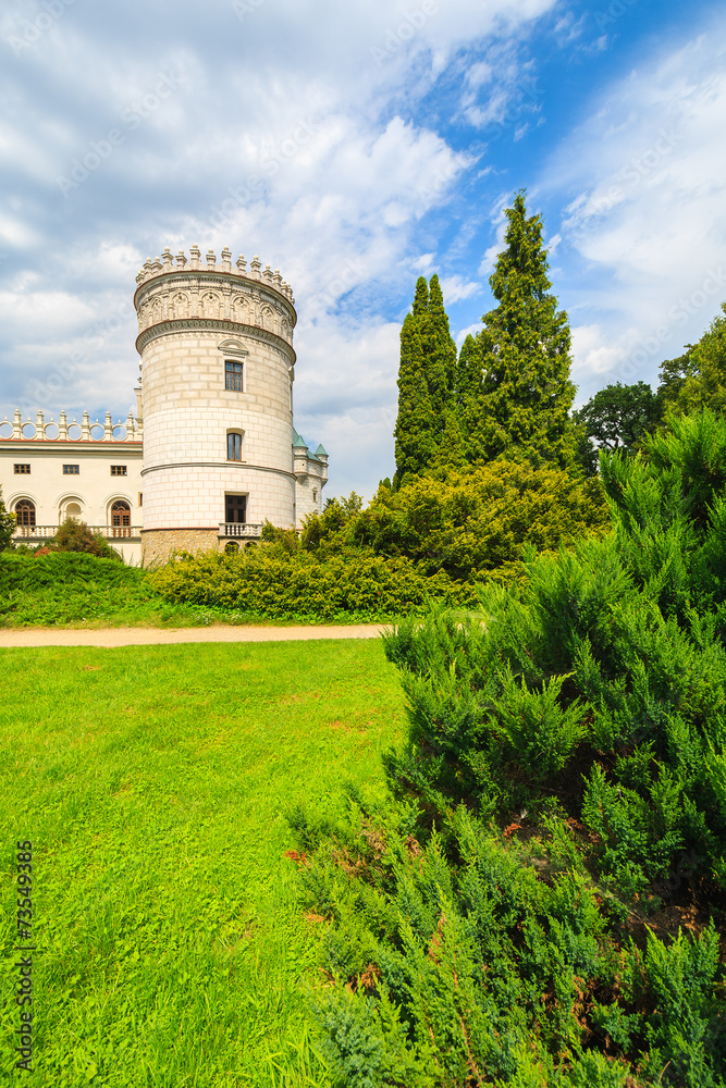 Green gardens of Krasiczyn castle on sunny summer day, Poland