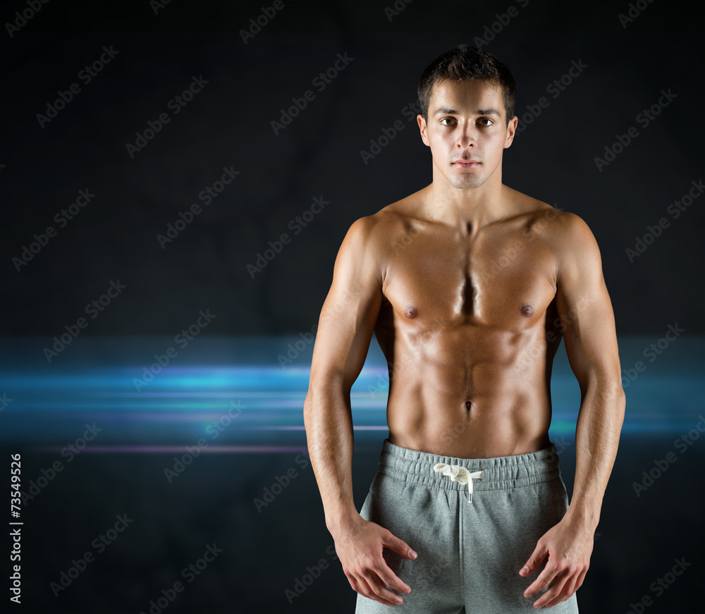 Fototapeta premium young male bodybuilder with bare muscular torso