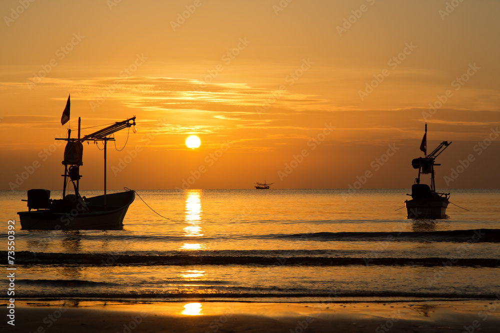 Silhouette boat in sunset