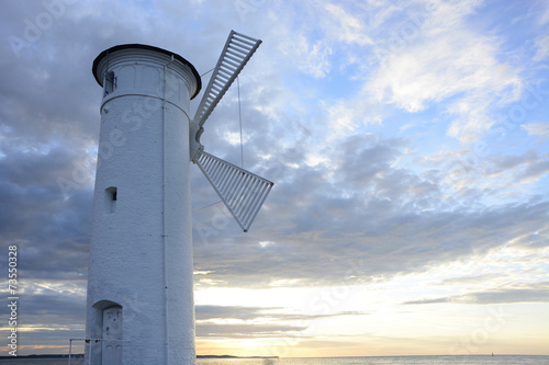 Lighthouse - windmill against the sky - Swinoujscie