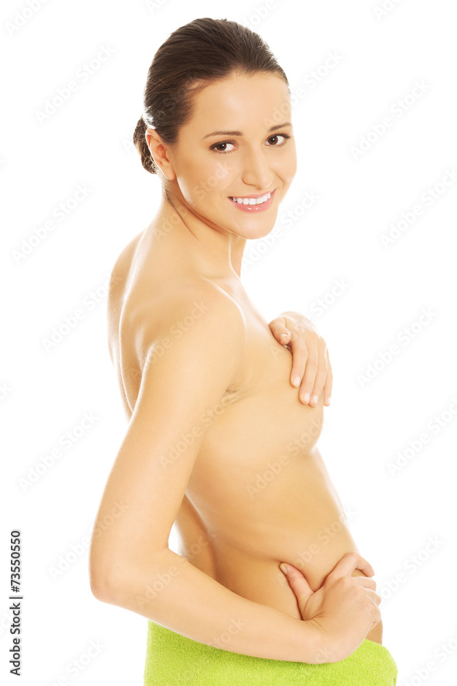 Nude woman wrapped in towel on hips Nude woman wrapped in towel on hips