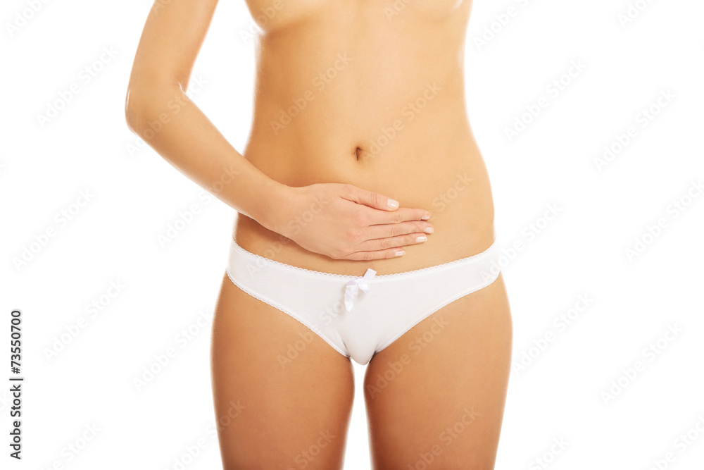 Woman touching her belly and massaging