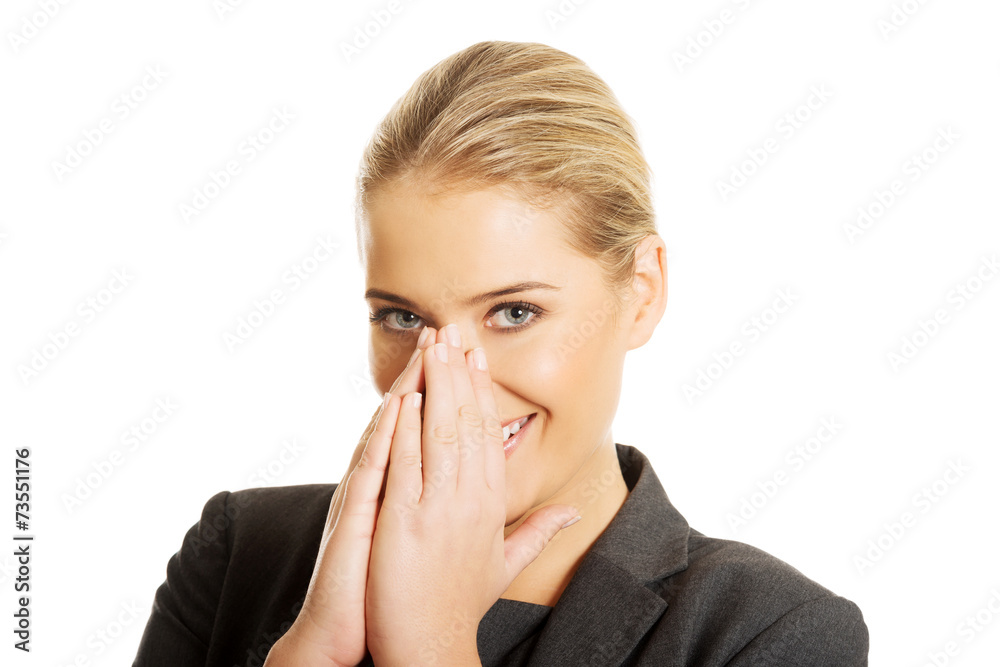 Laughing woman covering her mouth Laughing woman covering her mouth