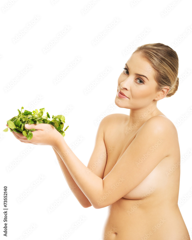 Happy nude woman holding lettuce Stock Photo | Adobe Stock