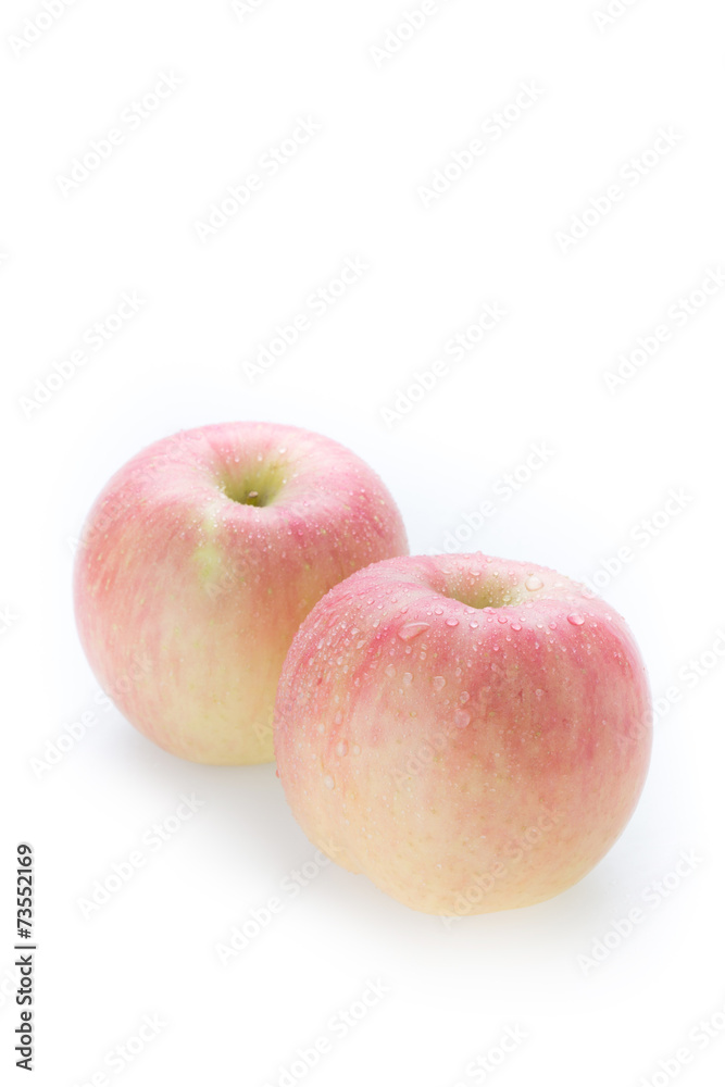 apple fuji fruit with water drops on white background apple fuji fruit with water drops on white background