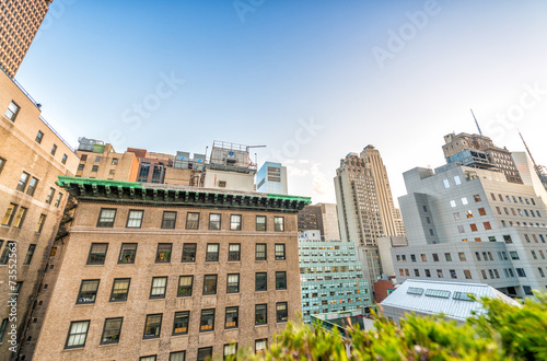 Buildings and roof garden in Manhattan. Amazing view at sunset i