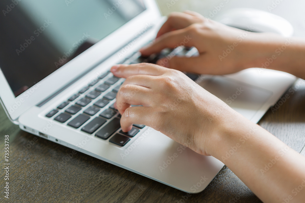 Closeup of business woman hand typing on laptop keyboard Closeup of business woman hand typing on laptop keyboard