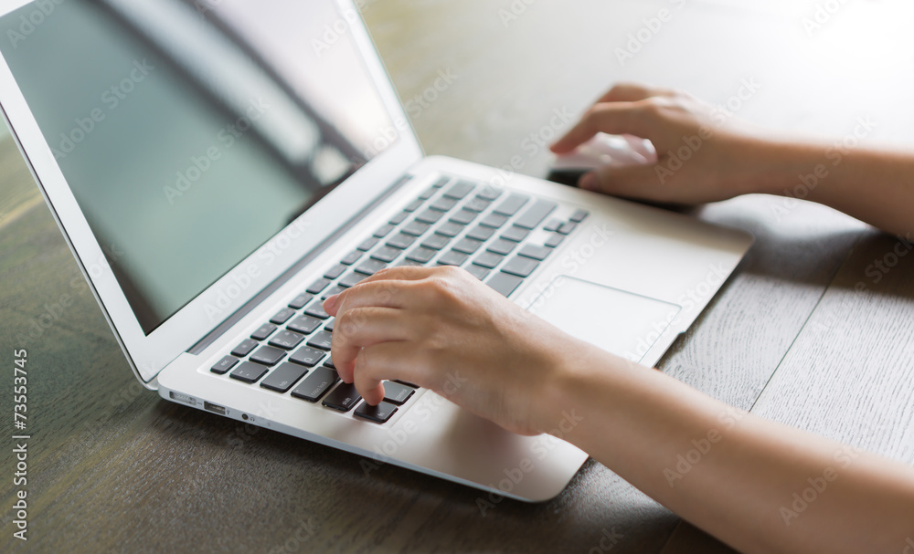 Closeup of business woman hand typing on laptop keyboard Closeup of business woman hand typing on laptop keyboard