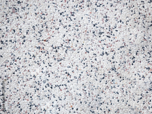 Mosaic of mix pebbles on white wall background