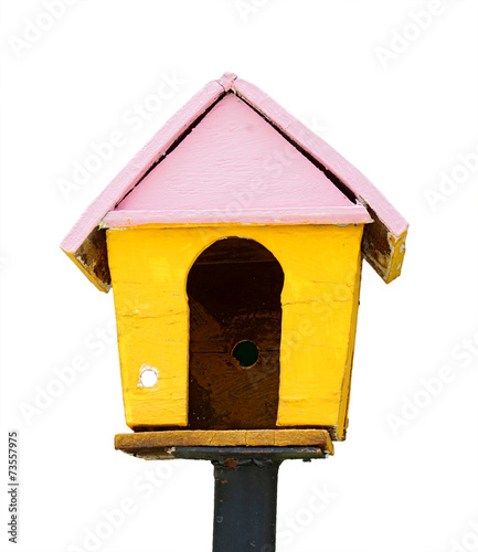 yellow wooden bird house on white background