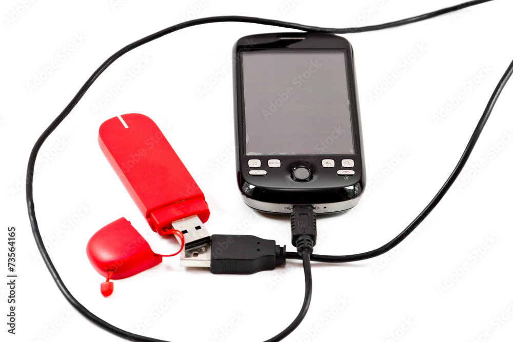 Handy mit USB Kabel und Internet Stick Stock-Foto | Adobe Stock