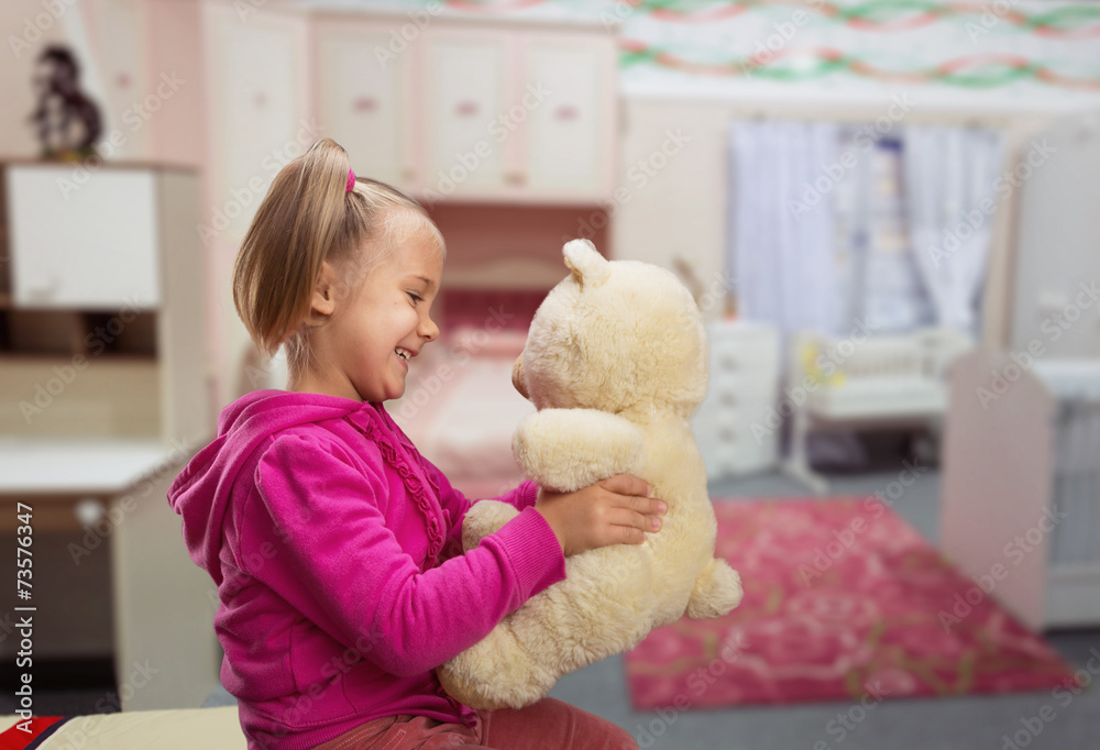 Small cute girl with toy beart Small cute girl with toy beart