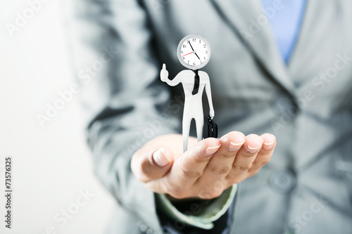 Photography Figure of punctual businessman on palm