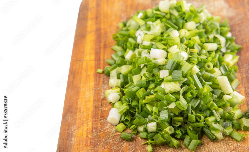 Spring onion or scallions on wooden cutting board Spring onion or scallions on wooden cutting board