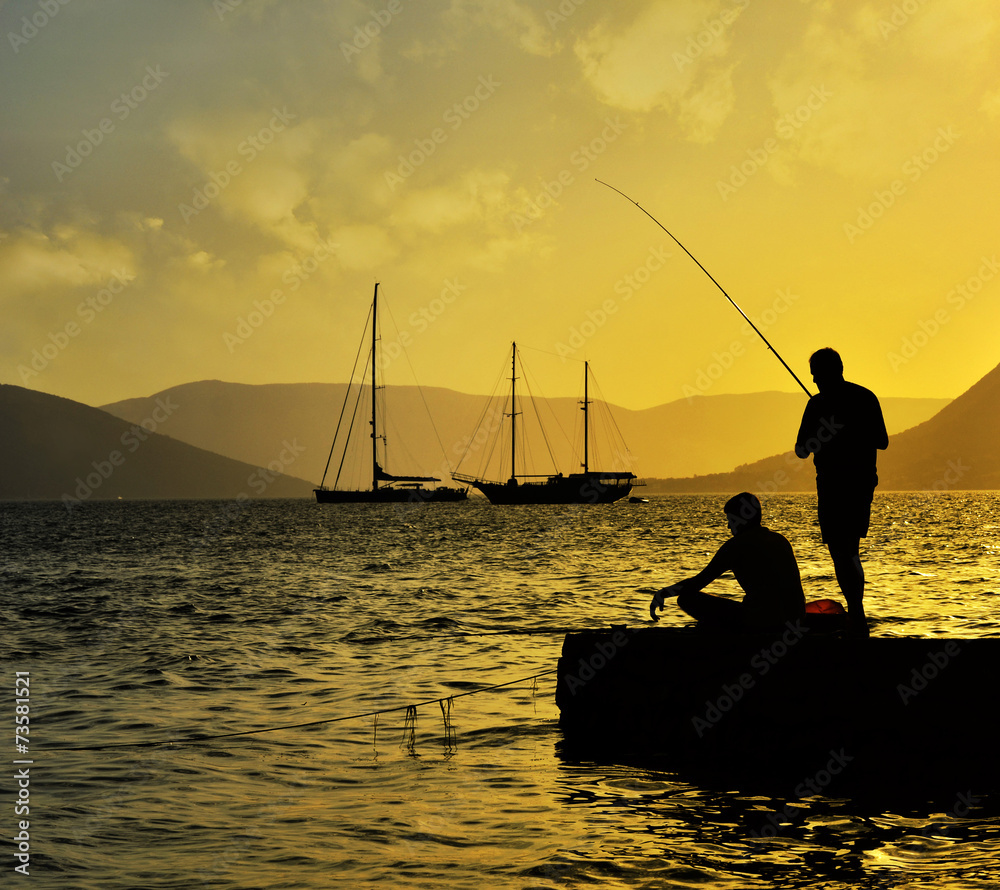 Fisherman silhouette at sunset, lifestyle image