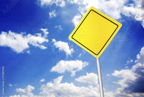 Road sign over the blue sky