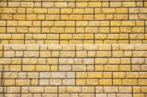 yellow wall with stone bricks