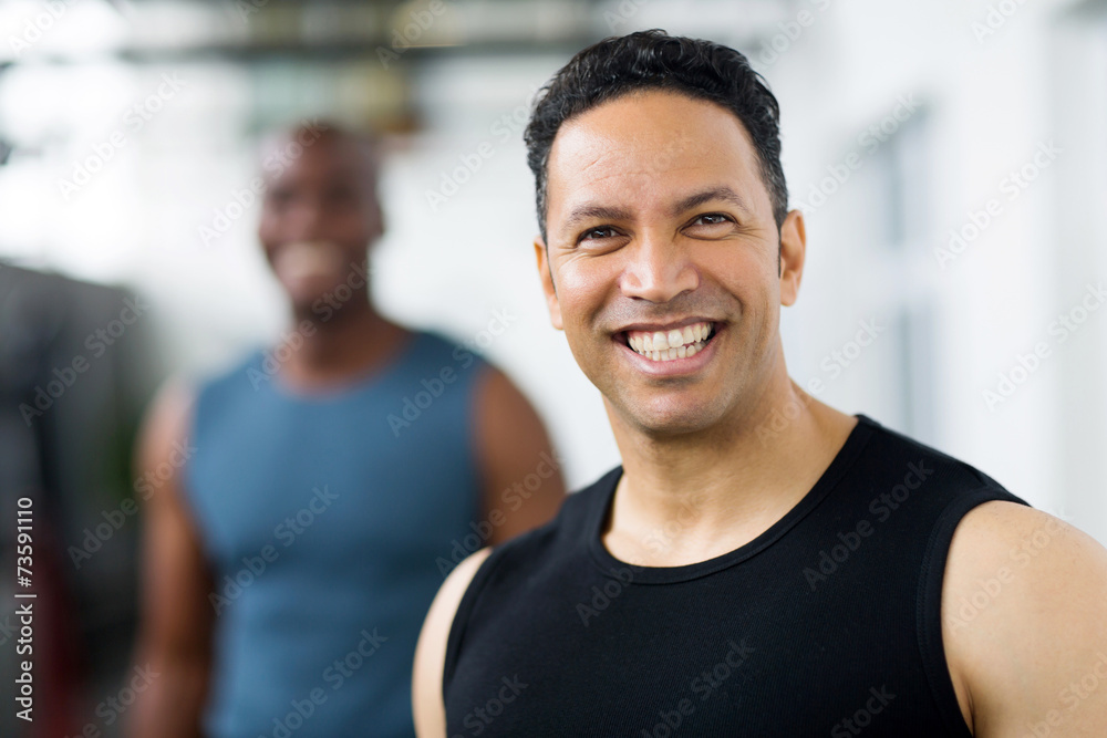 mid age male gym trainer closeup portrait