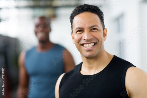 mid age male gym trainer closeup portrait