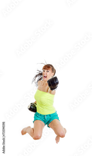 angry girl wearing boxing gloves ready to fight and punching or