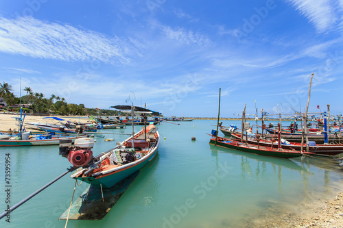Traditional Thai boat or long tail boat stand at the beach