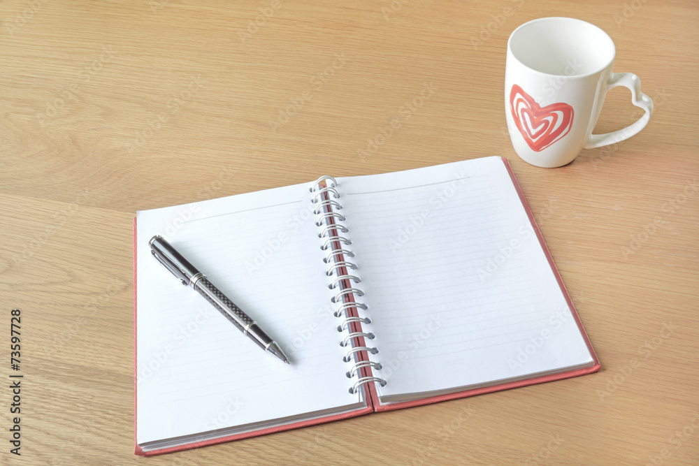 Open a blank white notebook and cup of coffee Open a blank white notebook and cup of coffee