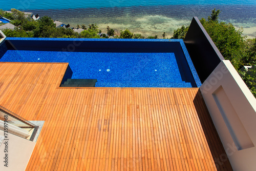 Wooden flooring beside the pool © SKT Studio
