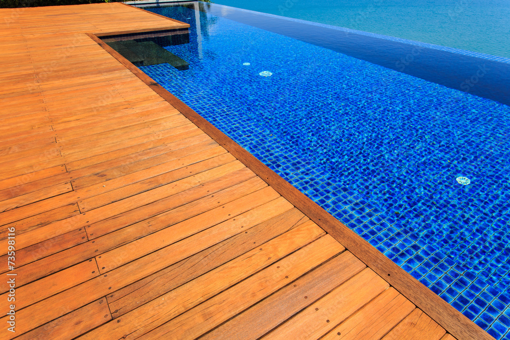 Wooden flooring beside the pool