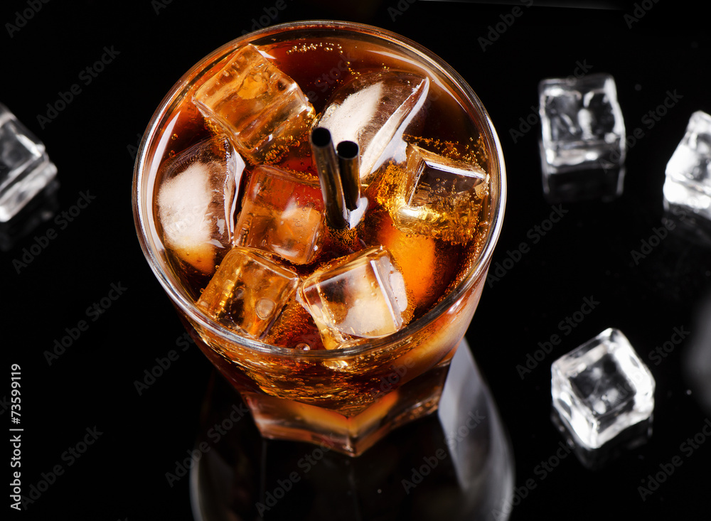 Full glass of cola with ice cubes