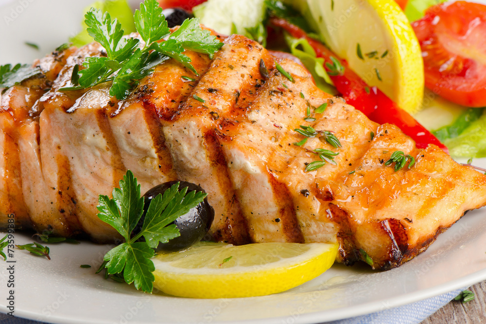 Grilled Salmon with fresh salad . Grilled Salmon with fresh salad .