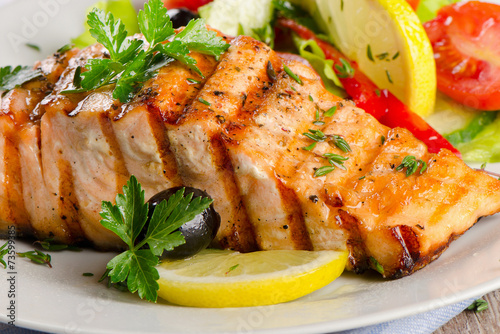 Grilled Salmon with fresh salad . photo