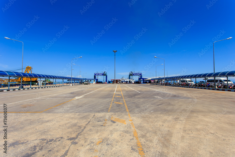 SURATTHANI - JULY 16 : A long ferry concrete pier. The main pier