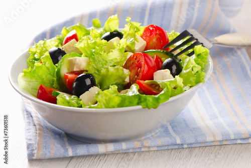 Healthy Greek  salad with feta, olives and vegetables .