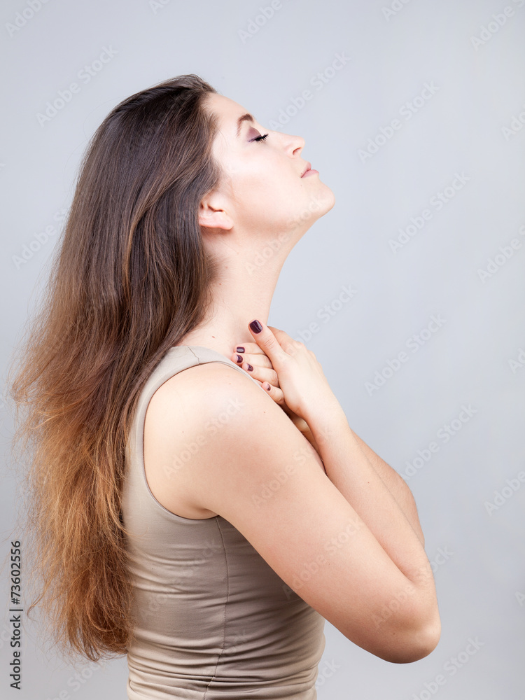 Naklejka premium Beautiful young caucasian woman doing face yoga pose