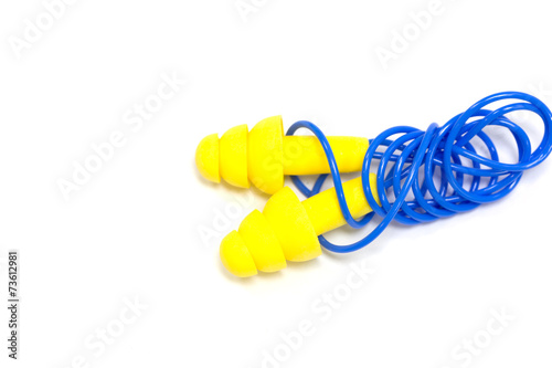 Obraz na płótnie Yellow earplugs with blue band w salonie