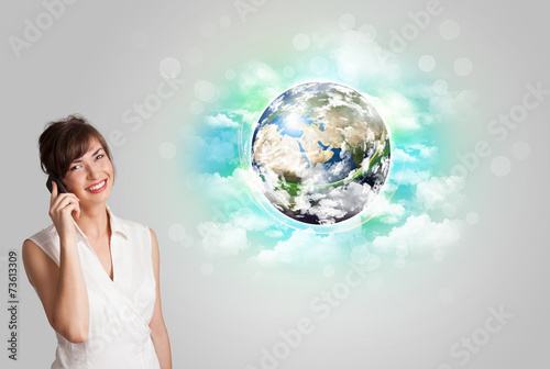 Young woman with earth and cloud concept