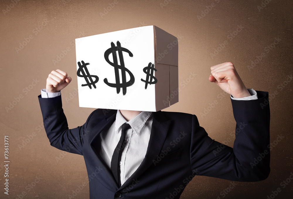 Businessman gesturing with a cardboard box on his head with doll Businessman gesturing with a cardboard box on his head with doll