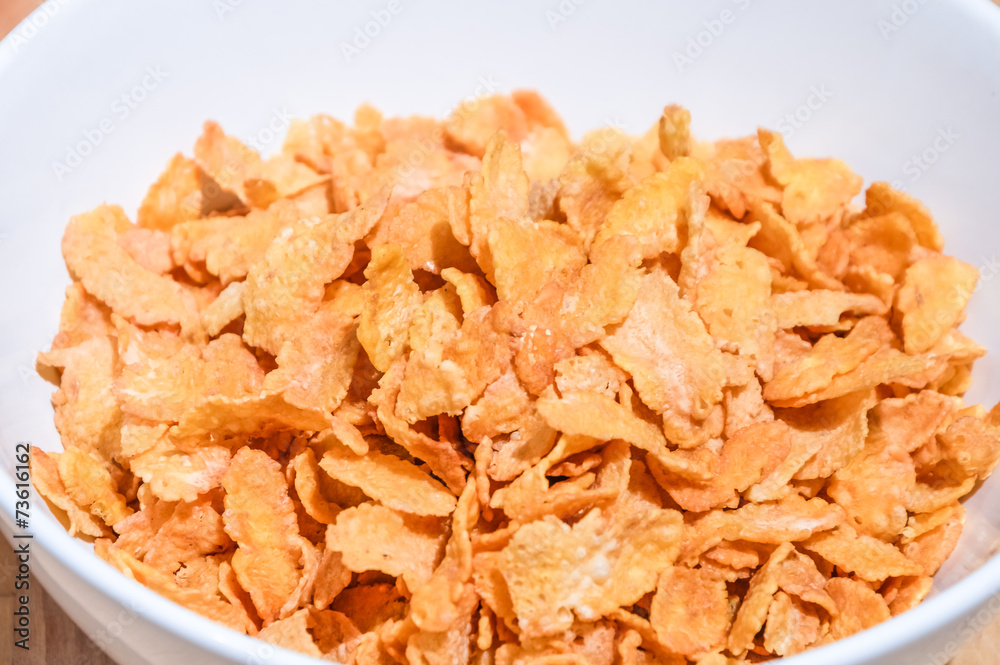 Bowl of cereal on a wooden table background Bowl of cereal on a wooden table background