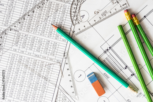 Architectural drawings, many pencils on the table with eraser an